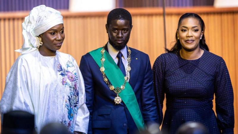 bassirou diomaye faye flanked by his two wives